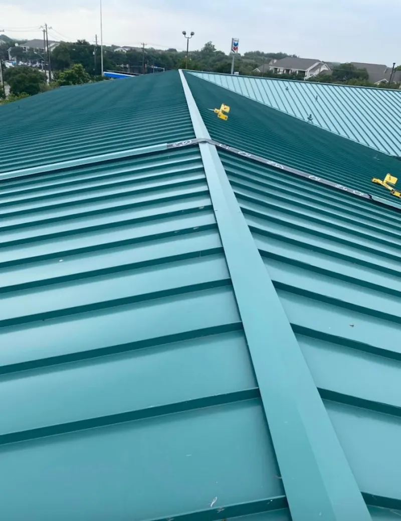 Green commercial metal roof ridge and valley for Metal Roof Repair in Kings Park West