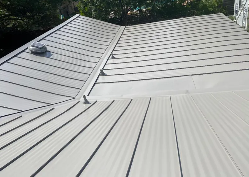 Solar attic fan installed on a metal roof for Roof Ventilation in Kings Park West